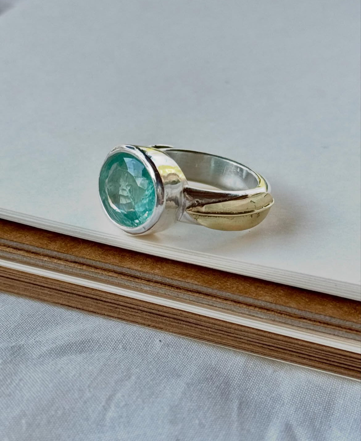Stunning natural aquamarine ring in fine silver and 14 karat gold.